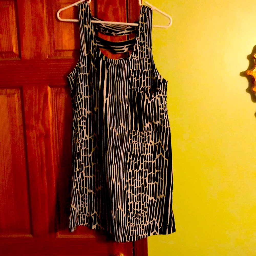 Hurley front pocket sundress with cut outs in the back.